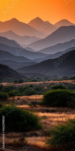 Stunning layered mountains under a golden sunset