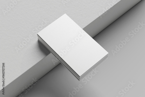 blank business cards on a grey background, text & logo