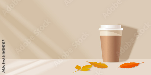 Paper coffee cup template with autumn leaves on a beige background
