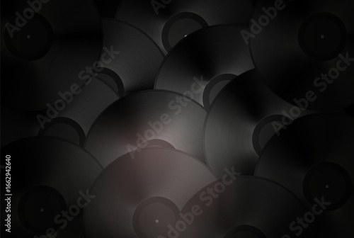 Vinyl record with a glossy black surface displayed on a dark background