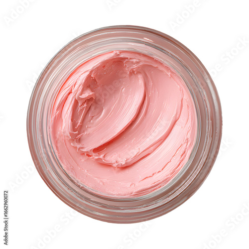 Top view of creamy pink skincare product in a glass jar on transparent backdrop