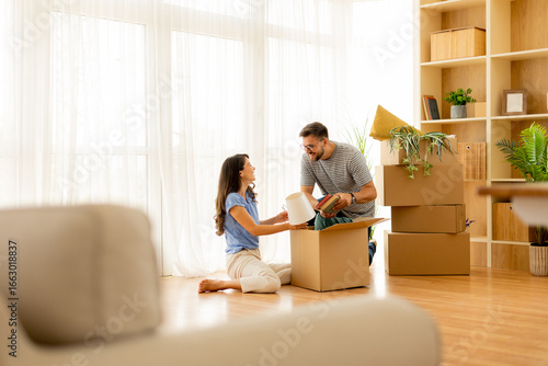 Couple joyfully unboxing th...