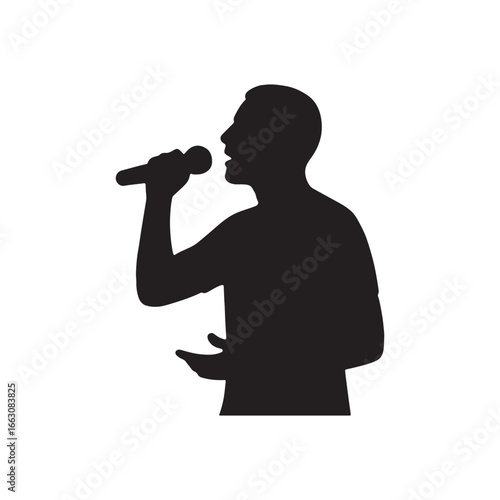 Silhouette of a male singer performing on stage with microphone in hand enthusiastically