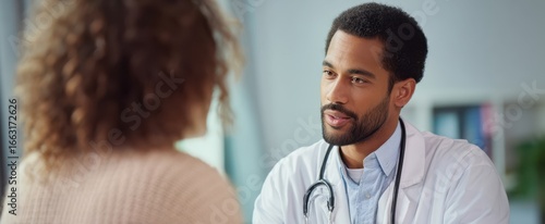 The doctor engaging in a compassionate consultation with a patient in a medical office.
