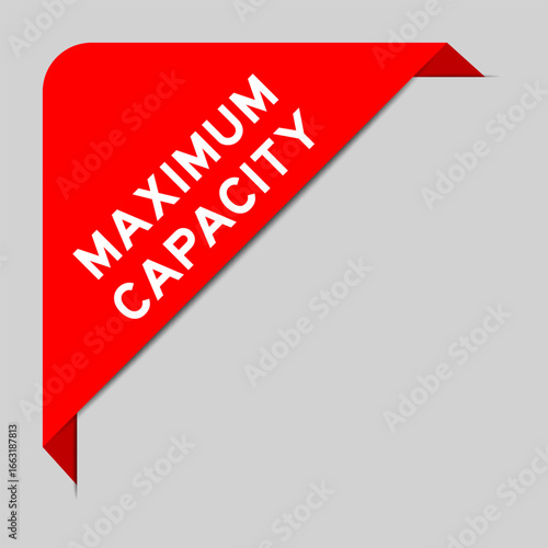 Red color of corner label banner with word maximum capacity on gray background