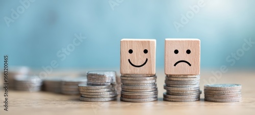 The emotional contrast of financial success versus failure represented by blocks and coins.