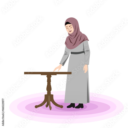 Muslim mothers are cleaning the house wiping the desk of a Muslim mother wearing a veil