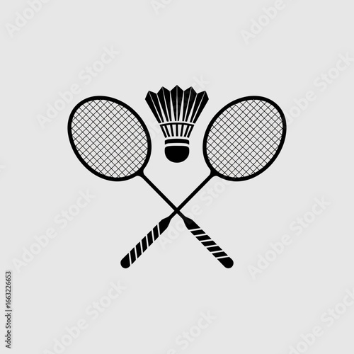 Two badminton rackets crossed with shuttlecock silhouette isolated on white background