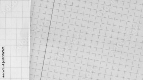 Seamless gray grid paper texture with square pattern. Perfect for use as background, abstract design element, wallpaper, or technical drawing surface in creative projects.