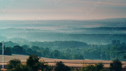 Green landscape with church in Lorry Mardigny village, France.