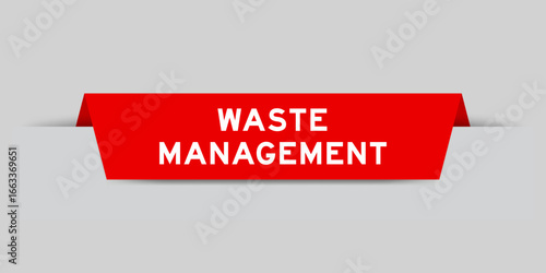 Red color inserted label with word waste management on gray background