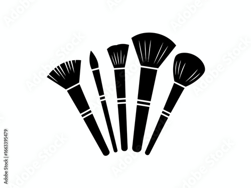 Collection of five makeup brushes in silhouette isolated on white background