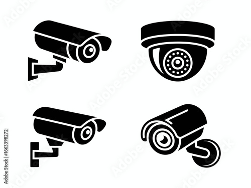 Collection of four black security camera silhouettes isolated on white background