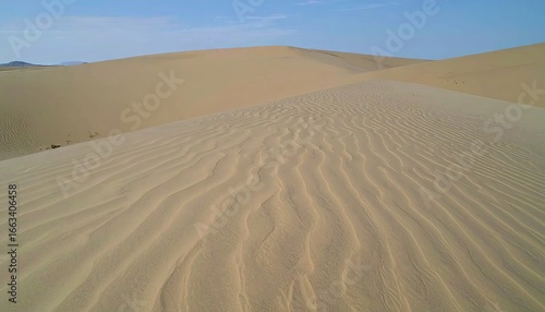Windswept Desert with Subtle Ridges and Rhythmic Sand Patterns