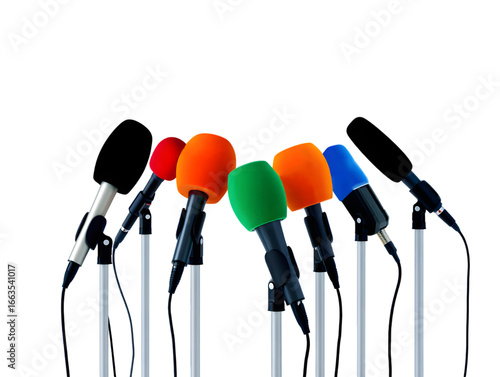 Cluster of colorful microphones on stands for press conference or media event in white transparent png background cutout	