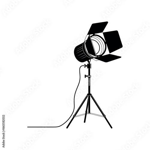 Black silhouette of a studio spotlight on a tripod with barn doors studio light lighting equipment