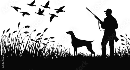 Silhouette of a duck hunter and his dog in a field with flying ducks
