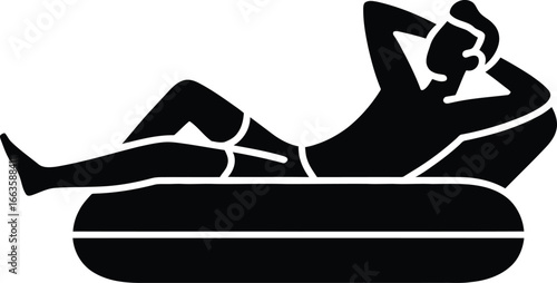 Man relaxing on inflatable tube with hands behind head