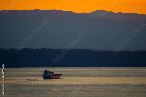 Cargo Ship Exits Puget Sound at Dusk