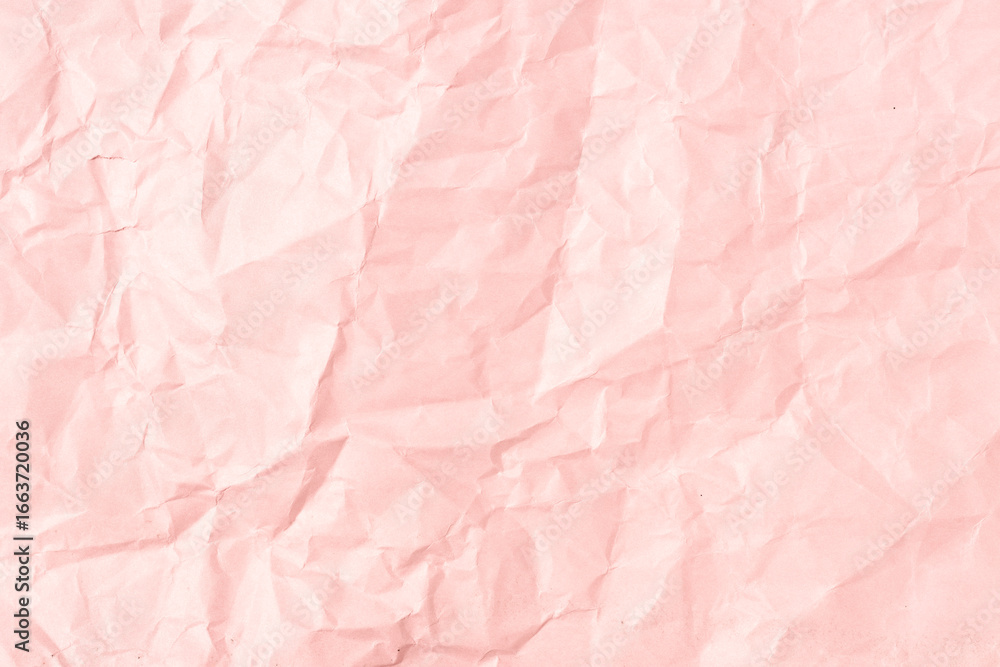 Fototapeta premium Pink crumpled paper background texture. Full frame