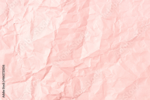 Pink crumpled paper background texture. Full frame