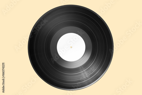 Vinyl record with bank label isolated on beige background. Mock up
