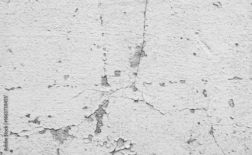 Black and white concrete background with cracks, defects and peeling paint