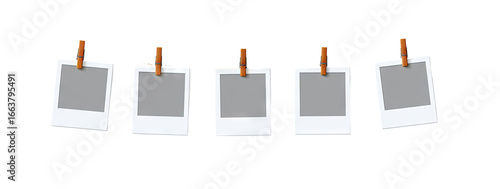 Five blank instant photos hanging