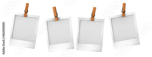 Four blank instant photo frames hanging