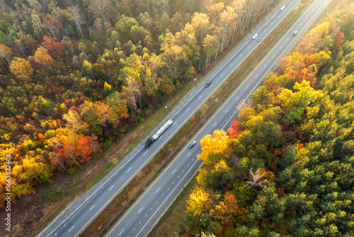 Photos Elevated view of freeway road lanes between autumn mountain hills