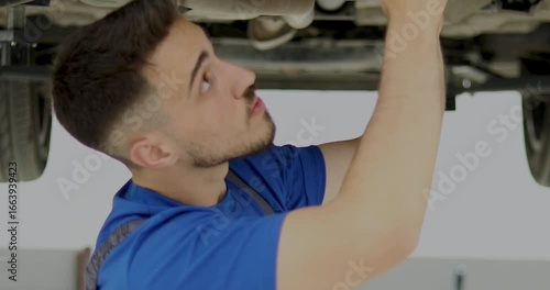 repairman at auto service workshop