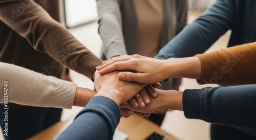 Diverse hands united in a powerful symbol of teamwork and collaboration