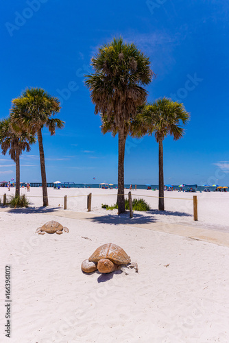 Replicas of Sea Turtles Under Palm Trees at Fort Myers Beach, Lynn Hall Memorial Park, Florida, USA