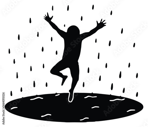 Silhouette of a person celebrating in the rain jumping in a puddle