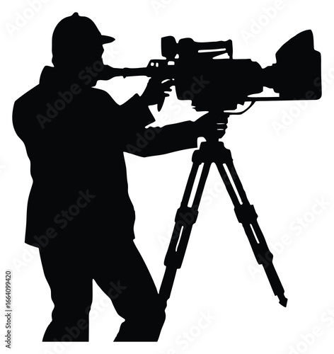 Silhouette of cameraman with professional video camera on tripod ready to film