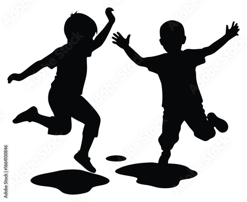 Silhouette of two playful young boys joyfully jumping in puddles of water