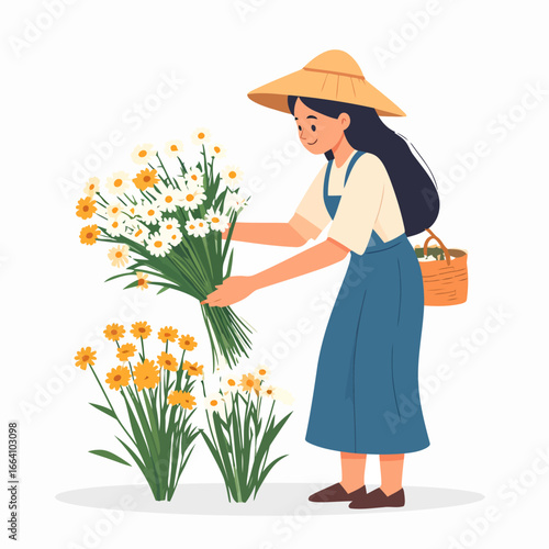 A smiling woman in a straw hat and blue dress gathering a large bouquet of white and yellow daisies.