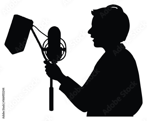 Silhouette of a person speaking into microphone with pop filter recording voice