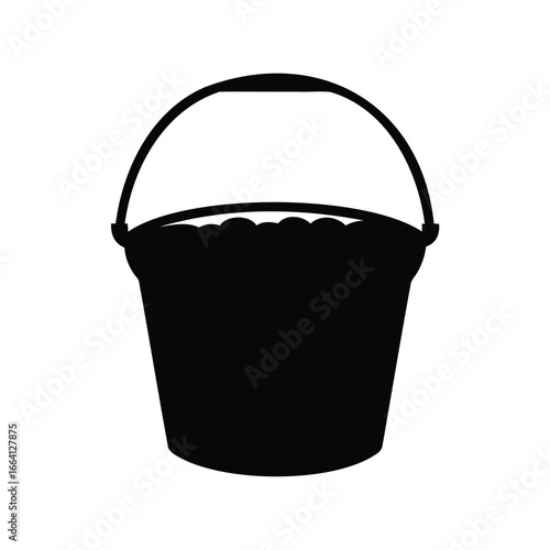 Black silhouette of a bucket overflowing with contents on a white background