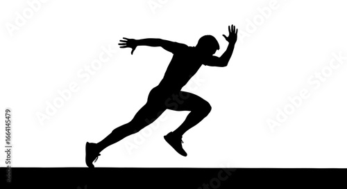 Silhouette of a sprinter powerfully starting a race, showcasing athleticism and speed.