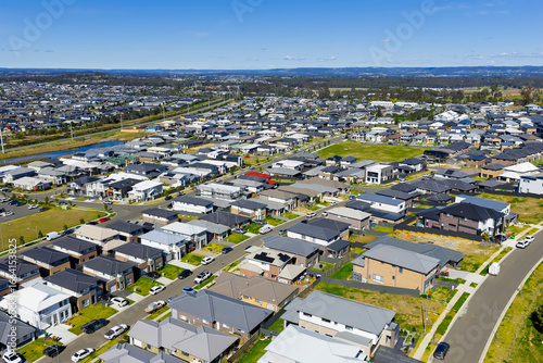 Drone aerial photograph of residential houses and neighbourhoods in the fast growing suburb of Oran Park in the Macarthur Region of South Western Sydney in New South Wales, Australia. 