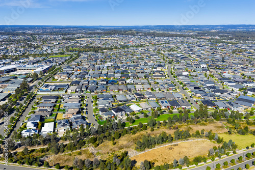 Drone aerial photograph of residential houses and neighbourhoods in the fast growing suburb of Oran Park in the Macarthur Region of South Western Sydney in New South Wales, Australia. 