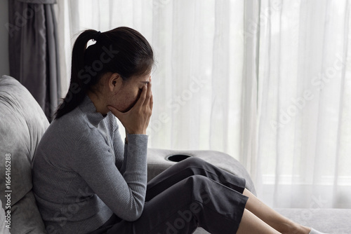 Canvas Print Asian woman sitting on the house area Feeling sad, tired and worried about depression, mental health problems and heartbreaking concept