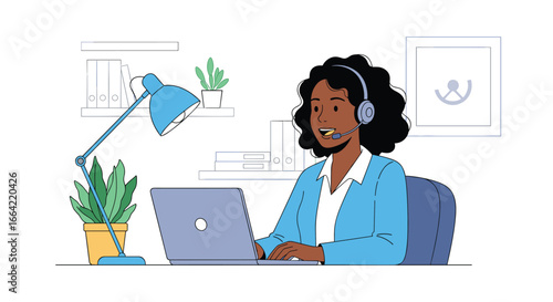 Focused individual wearing headset working diligently on laptop computer at a desk with plants and lamp
