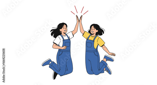 Two young women in blue overalls joyfully jumping and giving each other a high five celebrating success and teamwork