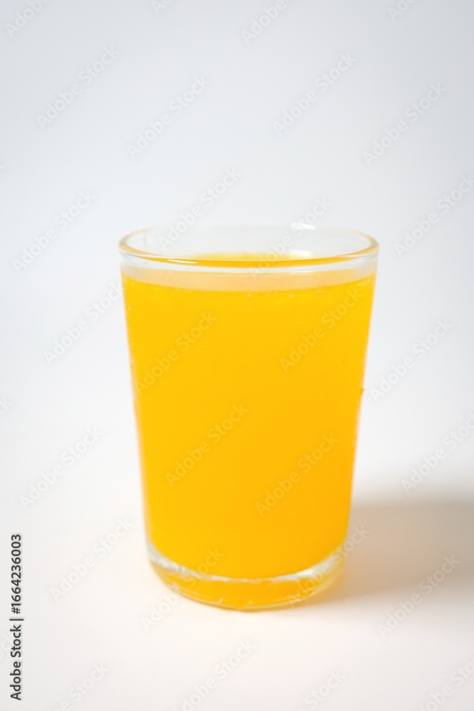 Orange juice in a glass on white background Orange juice in a glass on white background