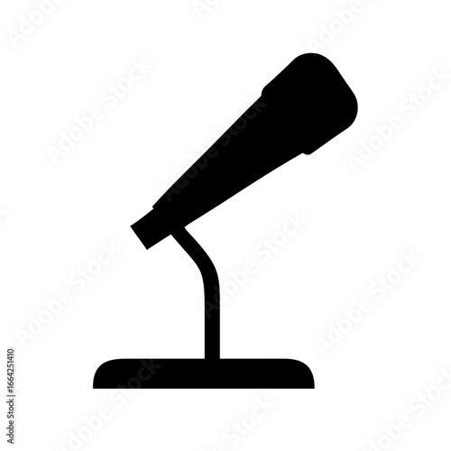 Silhouette of a microphone on a stand, a symbol of broadcasting and performance