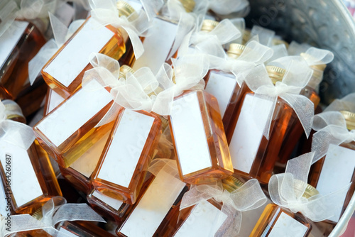 many honey bottle souvenir in basket for give to every guest in reception
