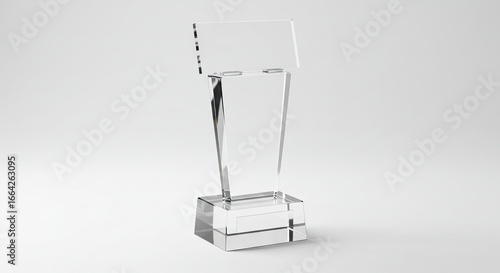 Clear glass trophy on a white background featuring a rectangular base tapering center and elevated top plate