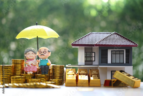 Mutual fund,Love couple senior with gold coin money and gold bar on natural green background, Save money for prepare in future and pension retirement concept